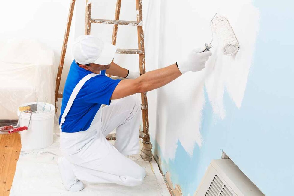 Interior painter applying wall paint